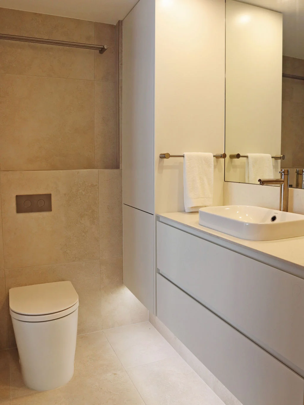 Custom laundry and bathroom cabinetry