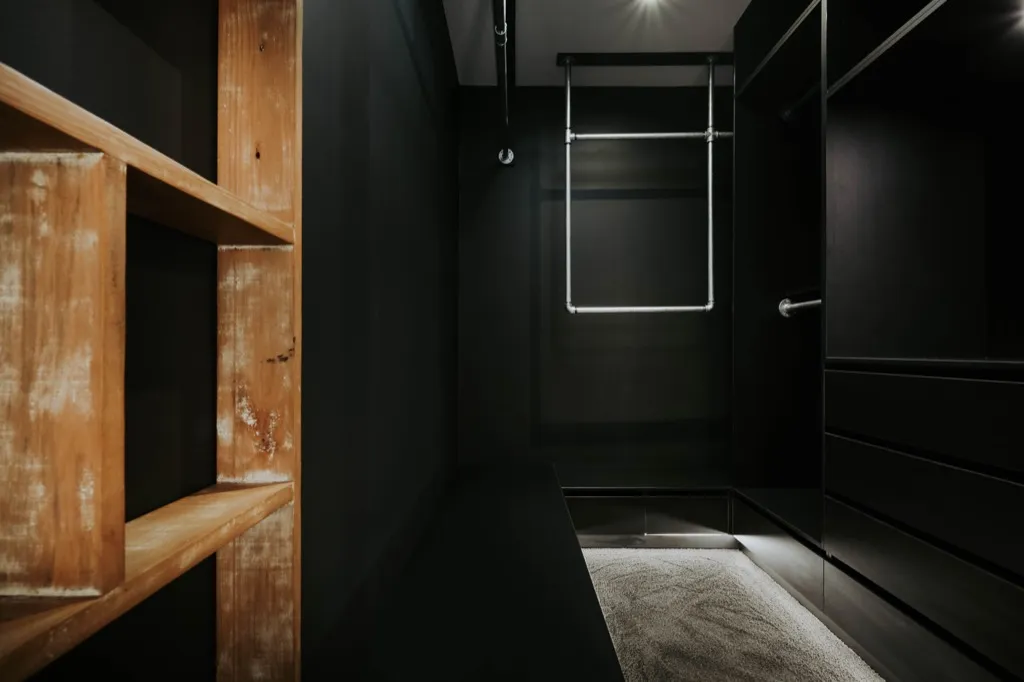 Walk-in robe with timber shelving and chrome rails